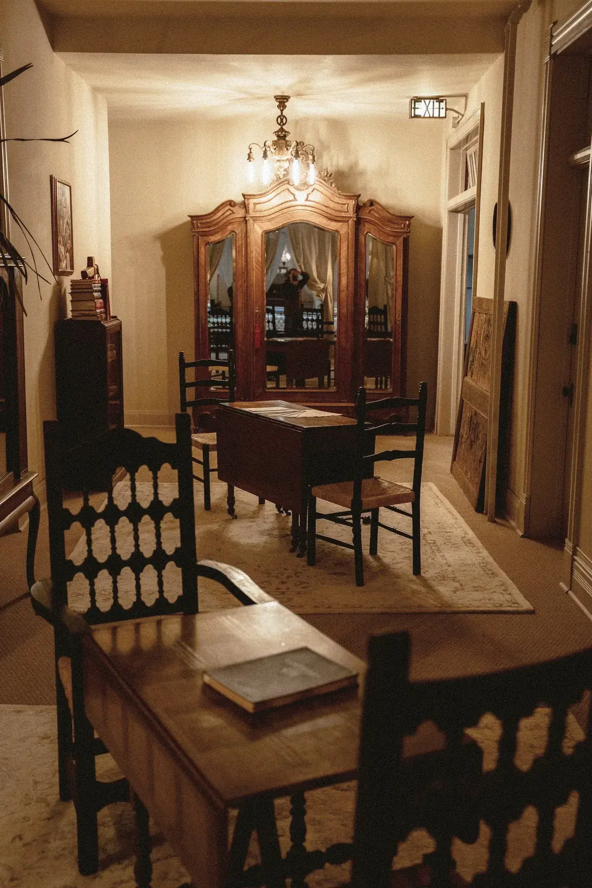 Long hallway at The Old Ruth with antique armoire and sitting area
