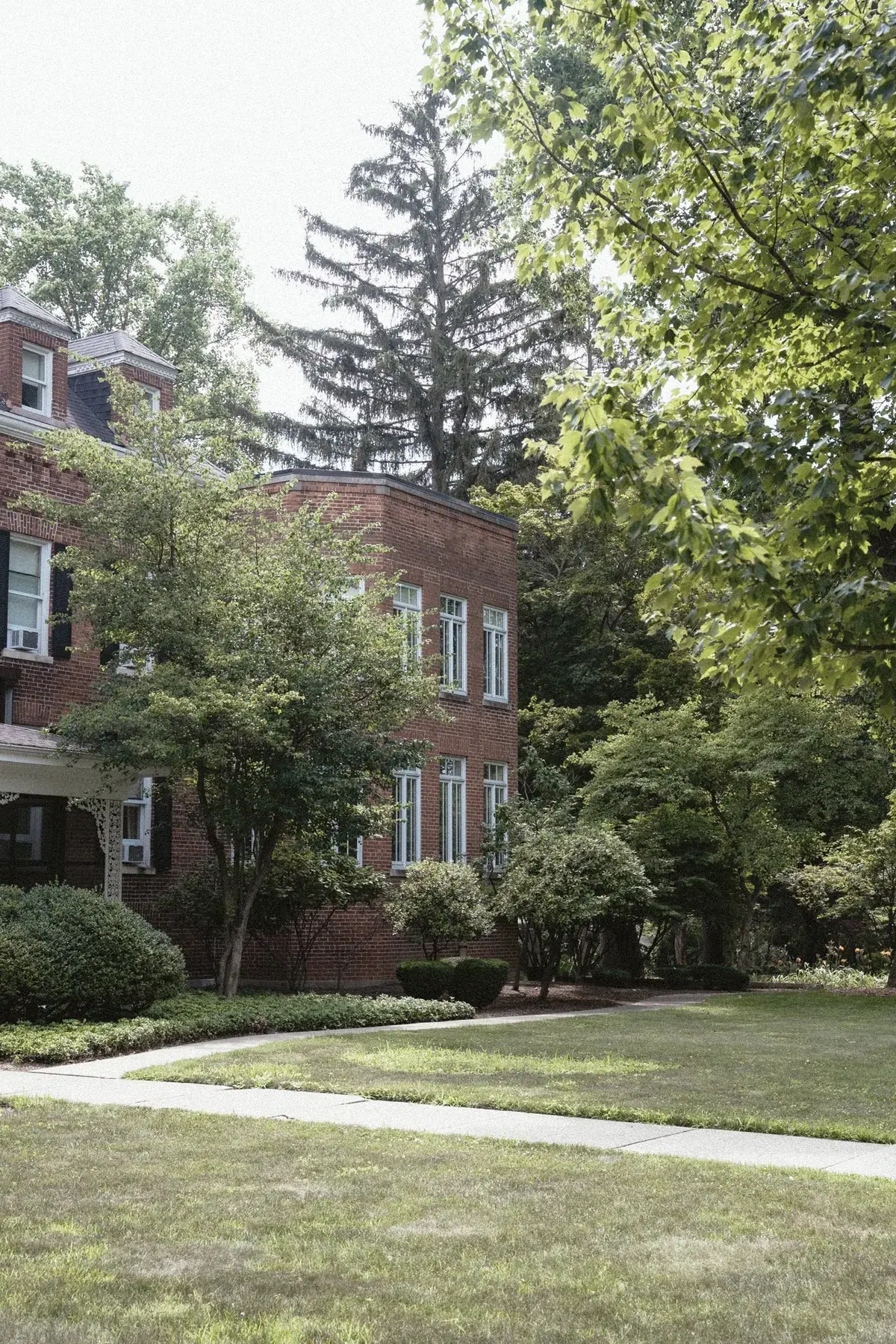 The Old Ruth estate grounds in summer — mature trees, manicured lawn, and walking paths on 3.3 acres in La Porte, Indiana