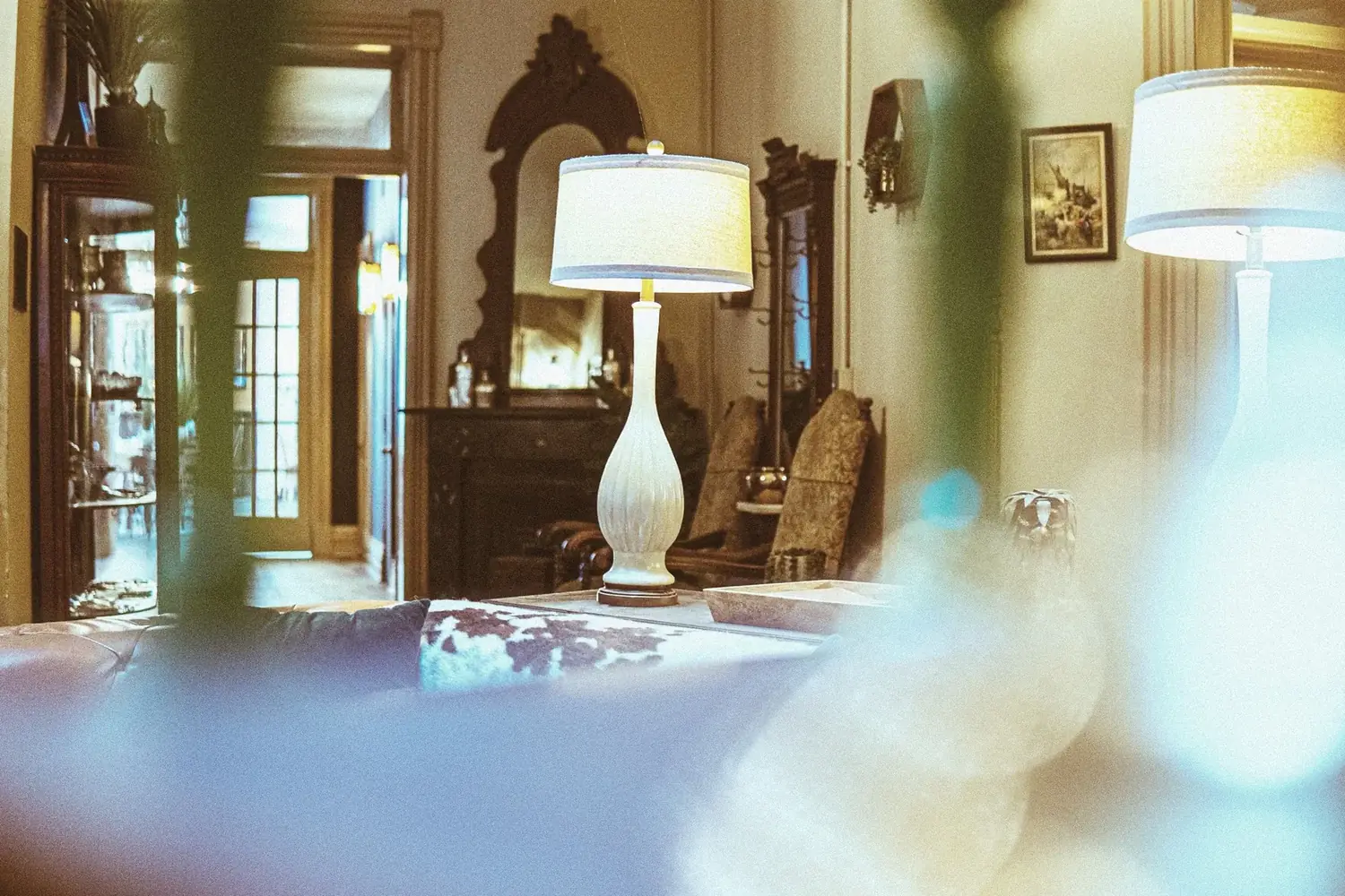 Lamplit lounge at The Old Ruth with long sightlines — shared living space for executive residents