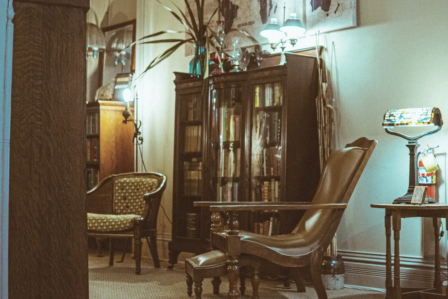 Library at The Old Ruth with leather chair and bookshelves